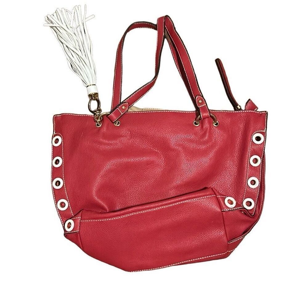 Sondra   Roberts squared red bag with white tassel. Super cute.
